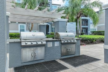 Outdoor kitchen with gas grills and picnic area